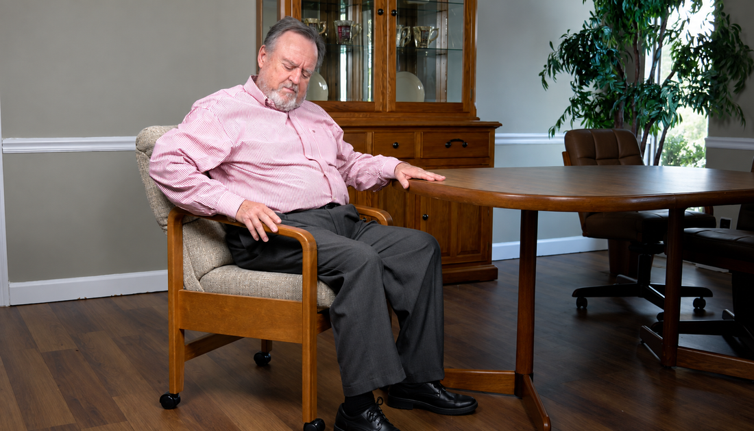 a senior dad trying on checking out the armrest of the Chromcraft TC03 Chair