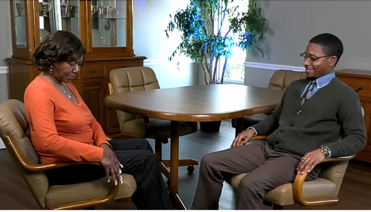 a senior mom with his adult son sitting on their chromcraft caster swivel tilt dining chairs comfortable having a conversation